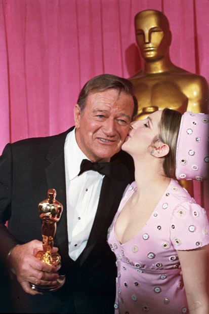 Barbra Streisand giving her love to " the Duke" after wining his Oscar PHOTO: Ladylike
